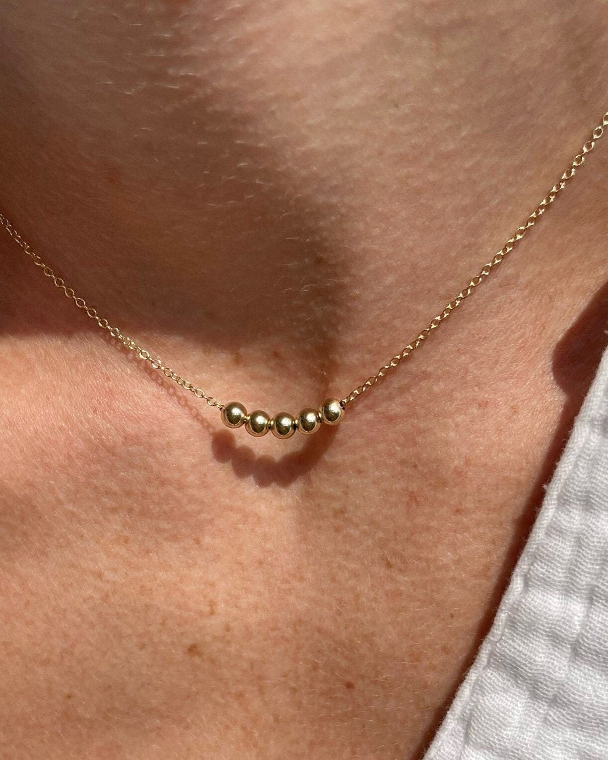 Gold Bead Fidget Necklace by Hannah May Jewelry