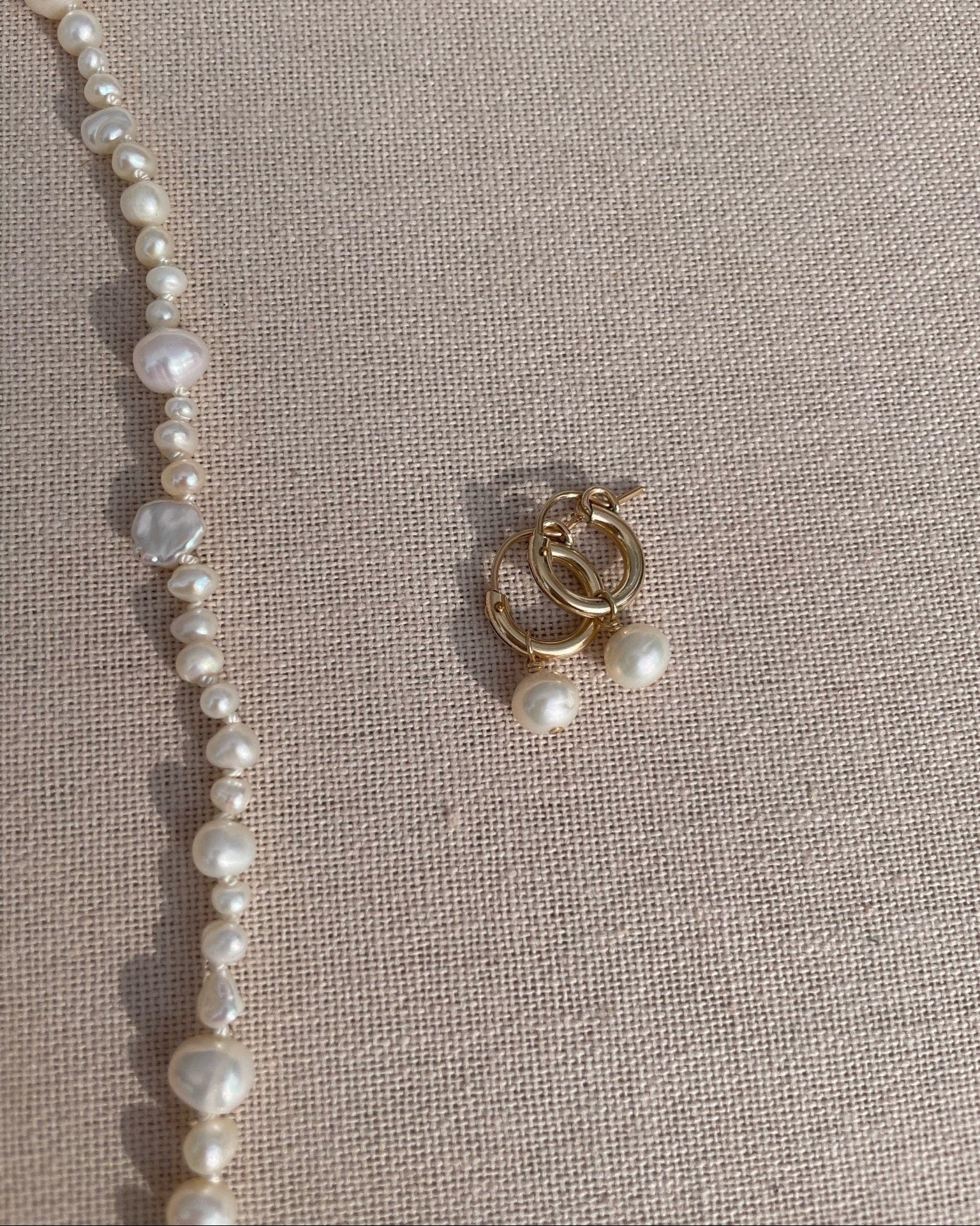 Pearl Huggie Hoop Earrings by Hannah May Jewelry