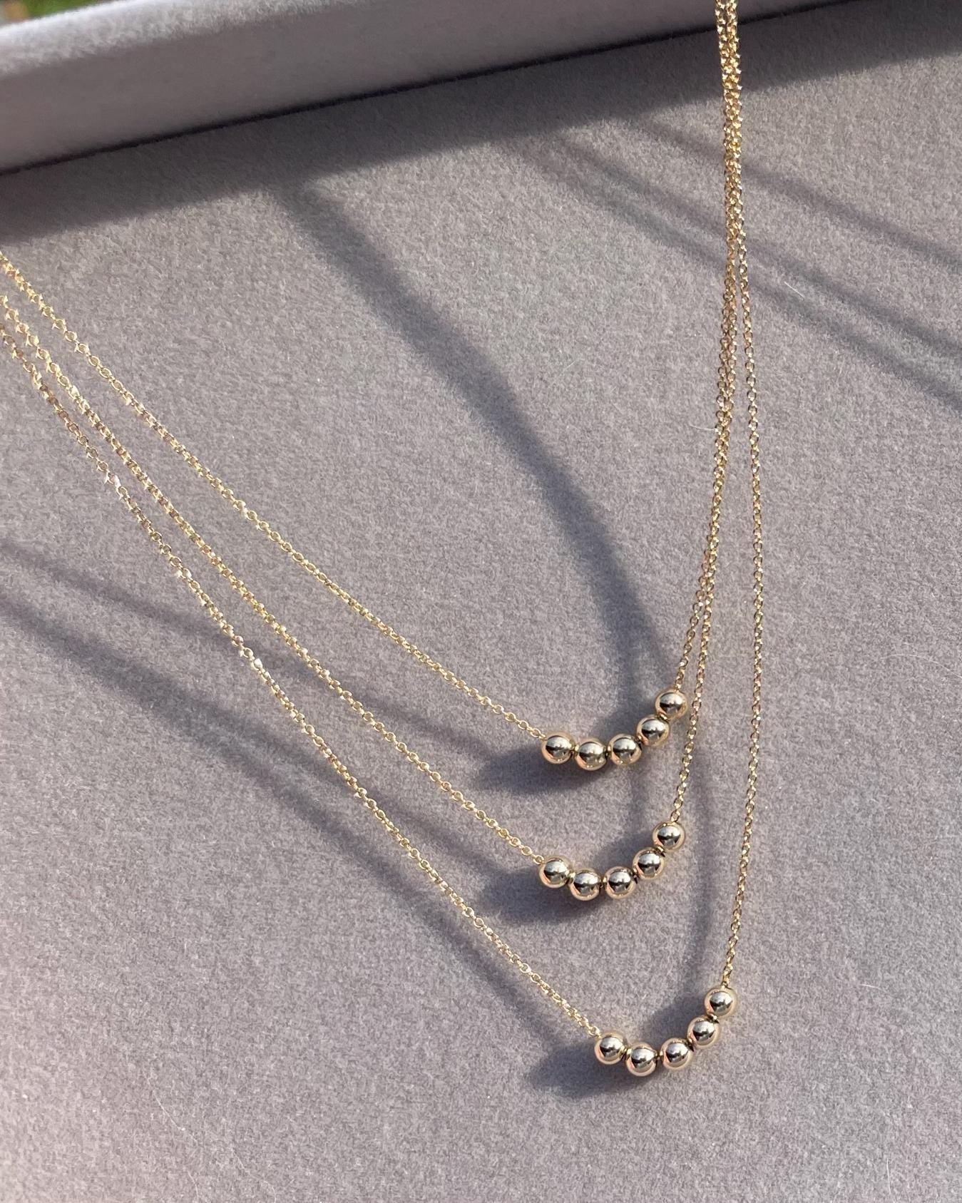 Gold Bead Fidget Necklace by Hannah May Jewelry