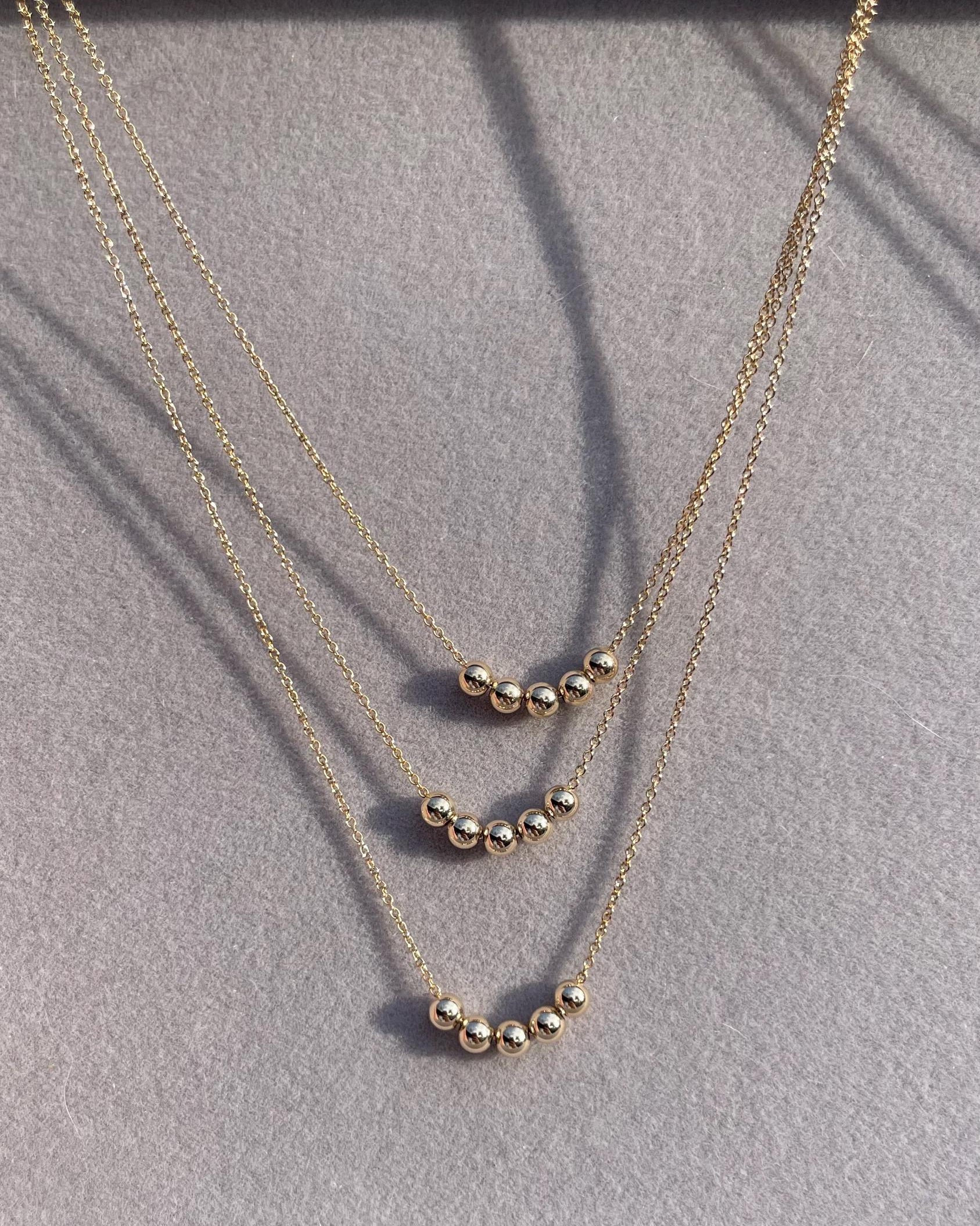 Gold Bead Fidget Necklace by Hannah May Jewelry